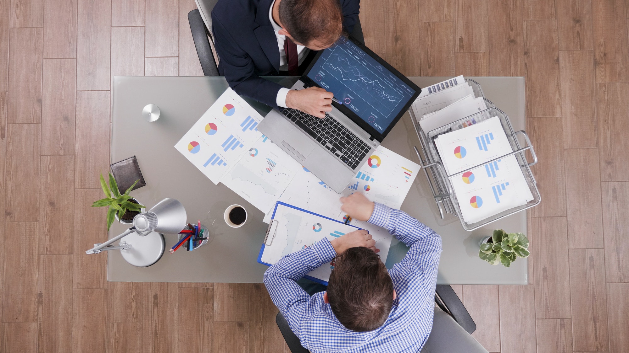 top-view-of-businessmen-analyzing-management-statistics-while-working-at-company-investments.jpg top-view-of-businessmen-analyzing-management-statistics-while-working-at-company-investments.jpg
